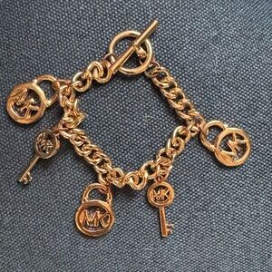 Michael Kors gold tone charm bracelet
